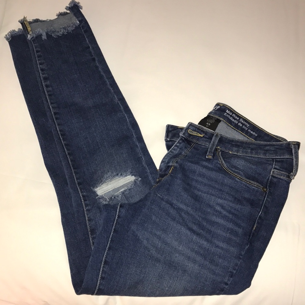 Trendy shaggy bottom ripped jeans